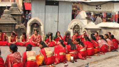 Group of Nepalese married women wearing red colored tradition attire gathered to celebrate Teej Festival