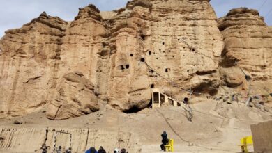 Bikers on Upper Mustang Tour stopping to admire the beaty of Caves in Chhoser, Upper Mustang