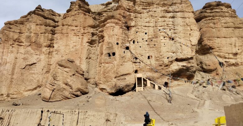 Bikers on Upper Mustang Tour stopping to admire the beaty of Caves in Chhoser, Upper Mustang