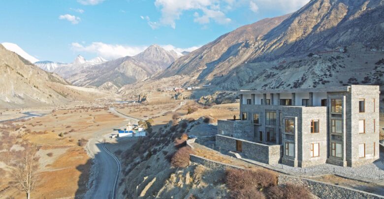 Photo of Mountain Lodges of Nepal in Manang overlooking Marsyangdi River and Hiamalayan backdrop.